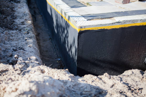 Professional Waterproofing technician working in Milton, NY